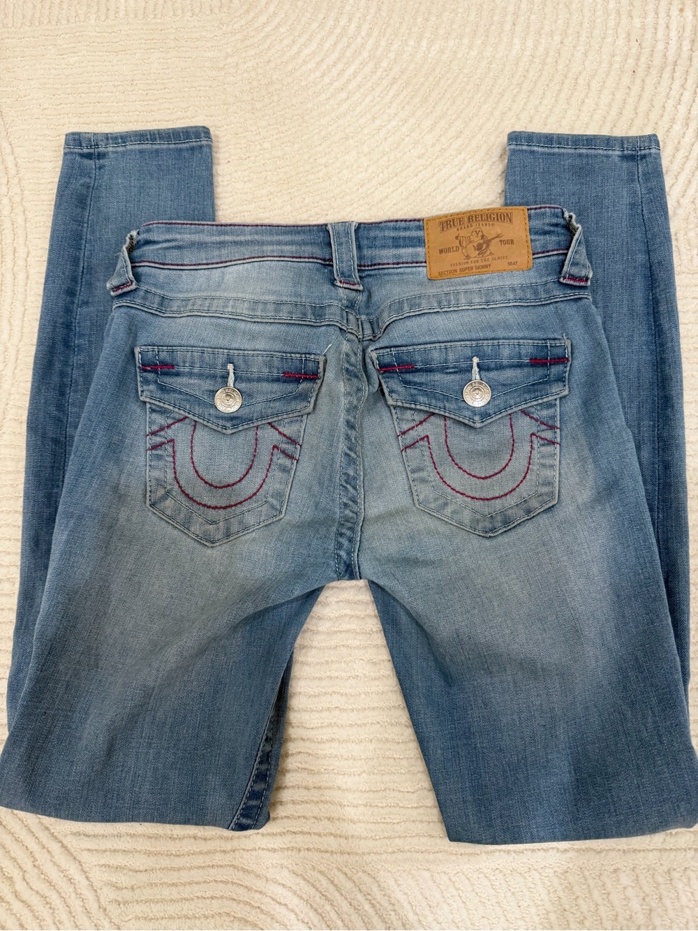 True Religion Women's Light Blue Boot Cut Jeans with Pink Stitching